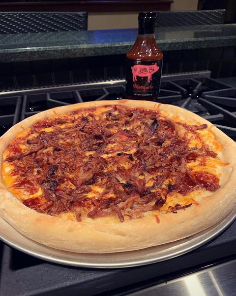 Home-made pizza with pork and barbecue