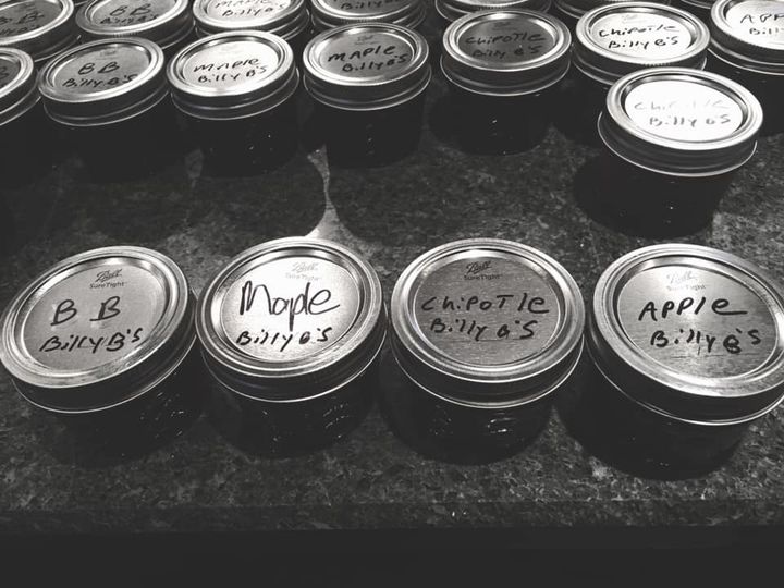 Small jars with hand writing on tops for new flavors